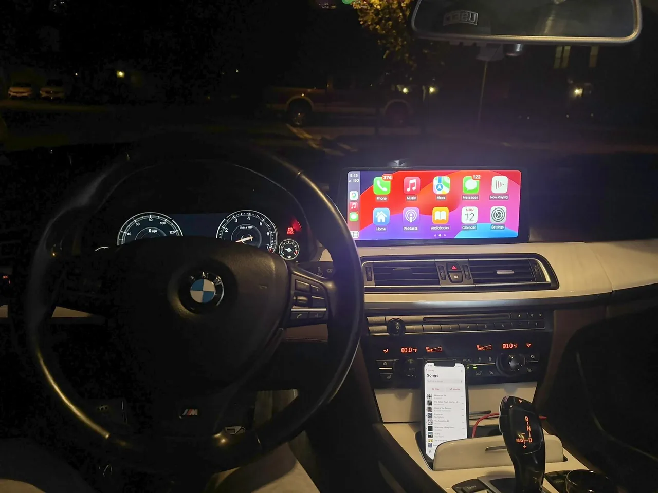 The same 750Li after installation, with Apple CarPlay on the new widescreen touchscreen